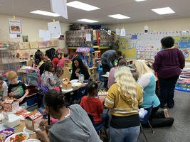 Pre-K making Gingerbread Houses